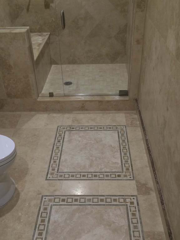 Executive Office Suite: Shower and tile inlay